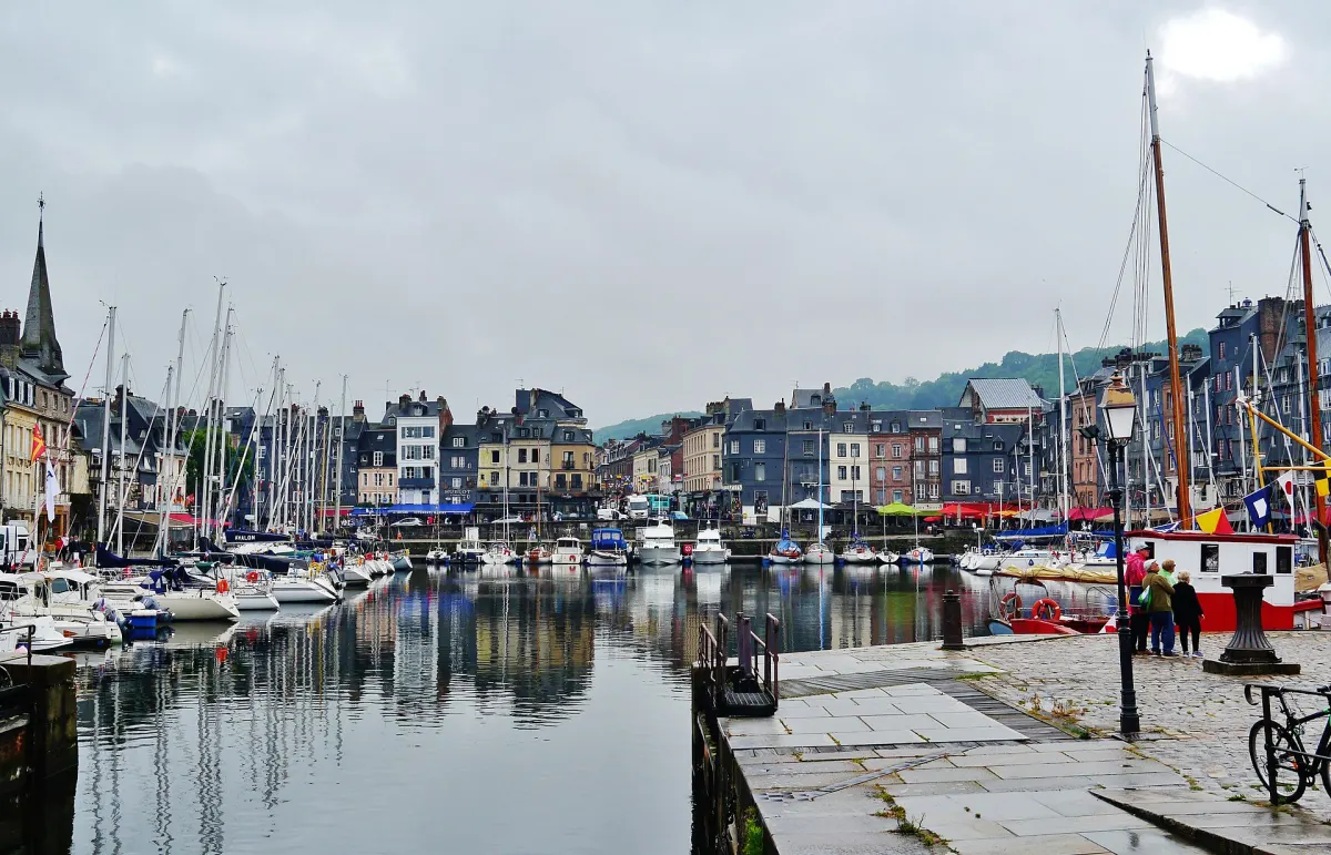 Boats and tall slate-fronted houses around the Vieux Bassin in Honfleur