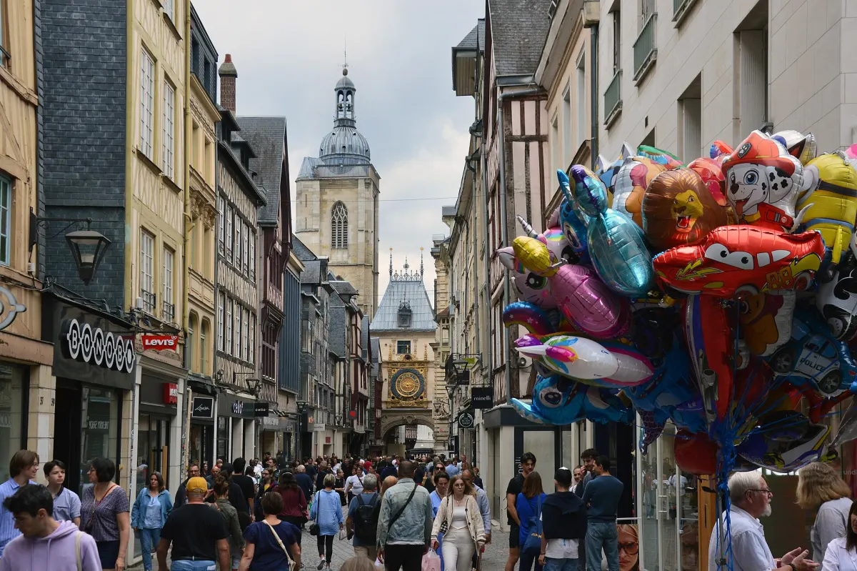 Rue du Gros-Horloge in Rouen with half-timbered houses and the clock tower in the distance